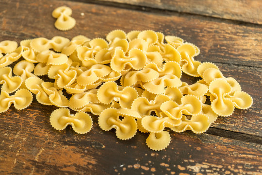 Italian pasta food, in a wood table on background