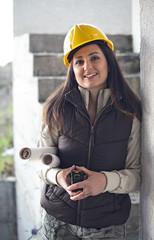 Young architecture woman in a construction