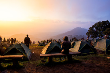 Tourists watch the sunrise Mountain in morning