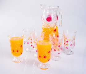 Orange juice in glasses on white background.