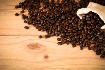 the arabica and robusta coffee beans with sack bag, copy space