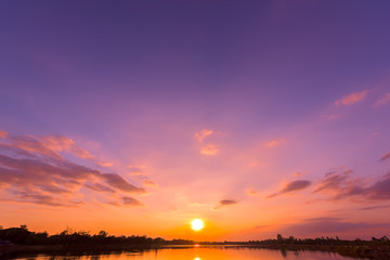 Fototapeta na wymiar Sunset sky background with landscape of calm lake at sunset