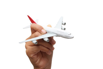 hand holding a model plane on white background