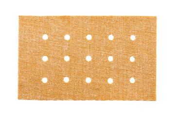 beige fabric adhesive plasters isolated on white background