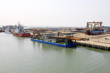 busy shipyard dock and docked ships