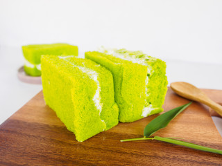 Bakery of green tea cake on wooden plate