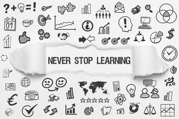 Never Stop Learning / weißes Papier mit Symbole