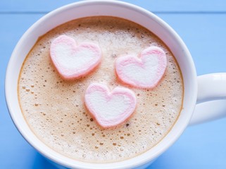 hot cappuccind with marshmallow heart shape