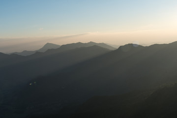 Obraz na płótnie Canvas Silhouette of Mountain Layers with sunlight