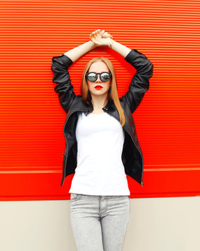 Fashion Pretty Woman Wearing A Rock Black Jacket And Sunglasses