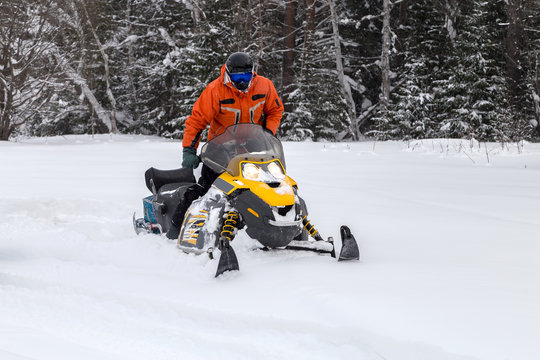 Athlete on a snowmobile.