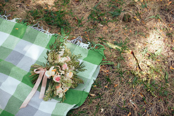 Wedding. bride's bouquet of white and beige flowers with greener