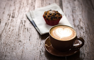 White cup of coffee on vintage wood. Top view , cup on wooden ta