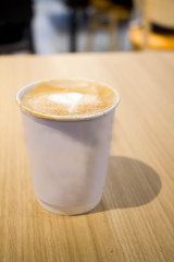 Latte coffee in paper glass