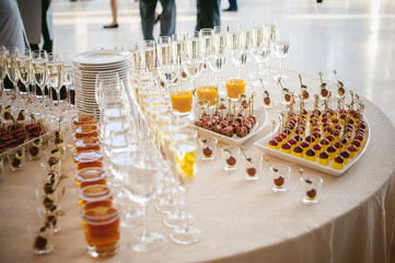 BANQUET beautifully served table with a variety of snacks and drinks