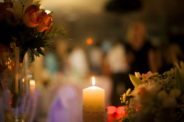 kindled flame of a candle on a blurred background