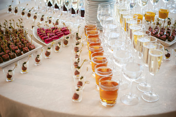 BANQUET beautifully served table with a variety of snacks and drinks