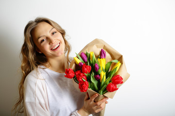 Happy smiling girl with flowers in their hands, the Concept of I