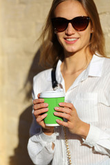 Smilling woman with cup coffee