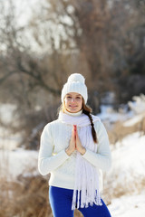 Smiling Yoga girl with a praying hands