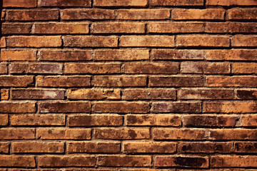 Old of concrete orange color blocks wall texture background.