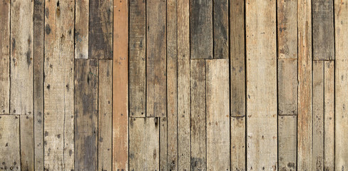 rustic weathered barn wood background with knots and nail holes old texture pattern wall brown