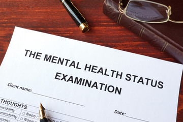 The mental health status examination (MSE) form on a surface.