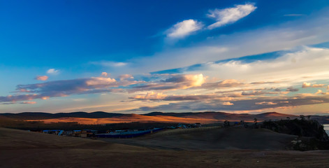 Hills Olkhon in a colorful sunset over the Khuzhir