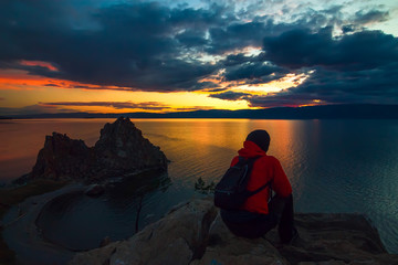 Man admiring the sunset at Cape Burhan on Olkhon