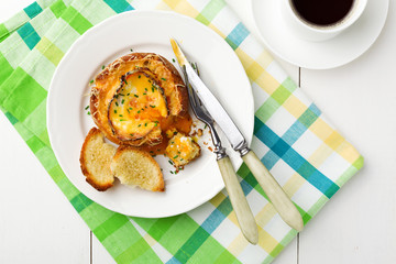 Baked sandwich with egg, cheese and ham.