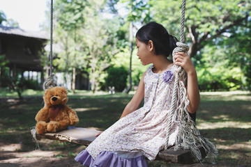 Teddy bear with girl  sitting - 136149795