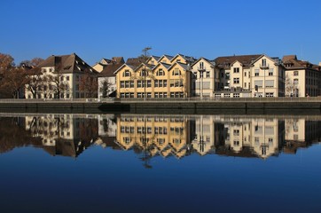 Row of houses in Schaffhausen reflecting in the Rhine