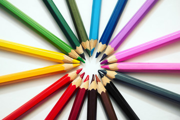 Naklejka premium Colored pencils on white background