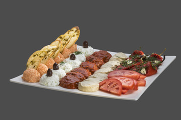 platter of pates and appetizers isolated on a gray background