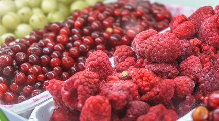 Close-up of frozen fruit in supermarket. Raspberries. Vitamins, healthy food