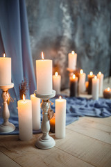 Romantic interior for Valentine's day with candles lights burning in room.
