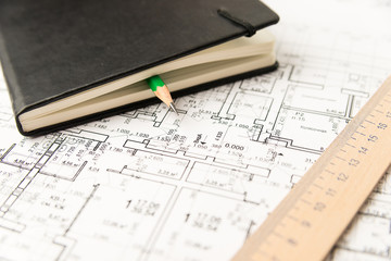 On the sheet of the drawing is a pencil with Notepad