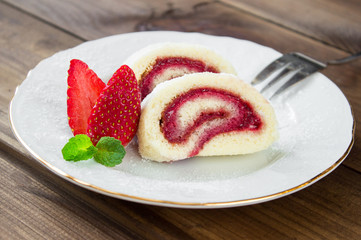slice of Homemade Sweet roll with Strawberry jam and berries