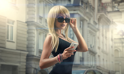 Girl with phone in sunglasses