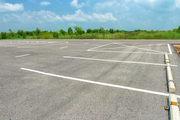 Empty parking lot on blue sky background