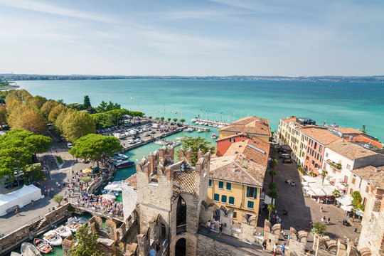Sunny view of town from viewpoint of Rocca di Sirmione at Garda lake, Lombardia region, Italy.