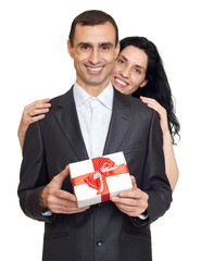 romantic couple with gift box, dressed in black suit, isolated white