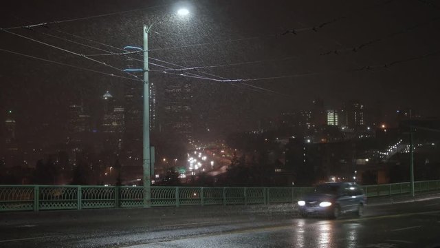 Night Cityscape of Bad Weather on Downtown Seattle, Washington with Snow Falling
