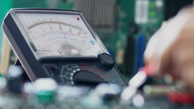 Closeup shot of a laboratory technician working with Multimeter
