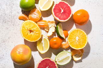 different kinds of citrus on white background