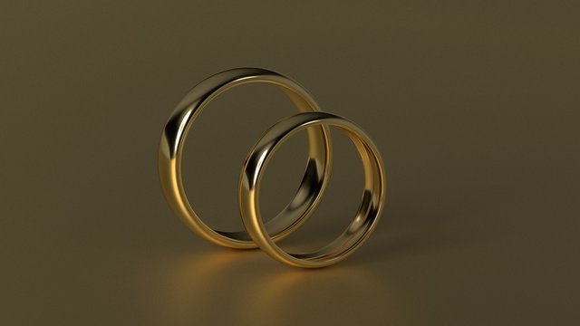 The beauty golden wedding ring on gold background. 3d rendering