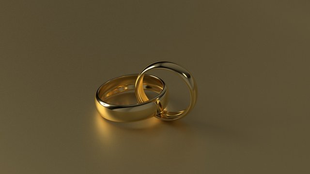 The beauty golden wedding ring on gold background. 3d rendering