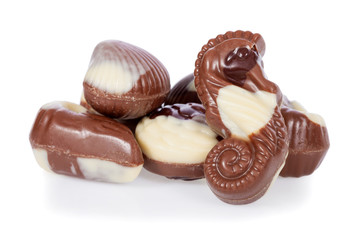Belgian bonbons shaped as seashells isolated on white background