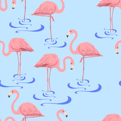 Seamless pattern with a flock of flamingos standing in water on a blue background