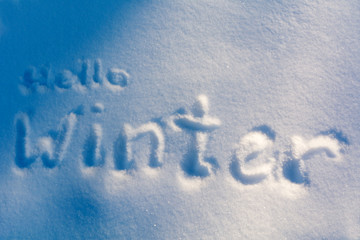 the inscription on the snow «Hello, Winter»